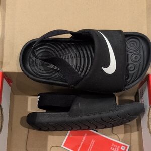 Nike Black Kids' Slide Sandals with White Swoosh and Back Strap